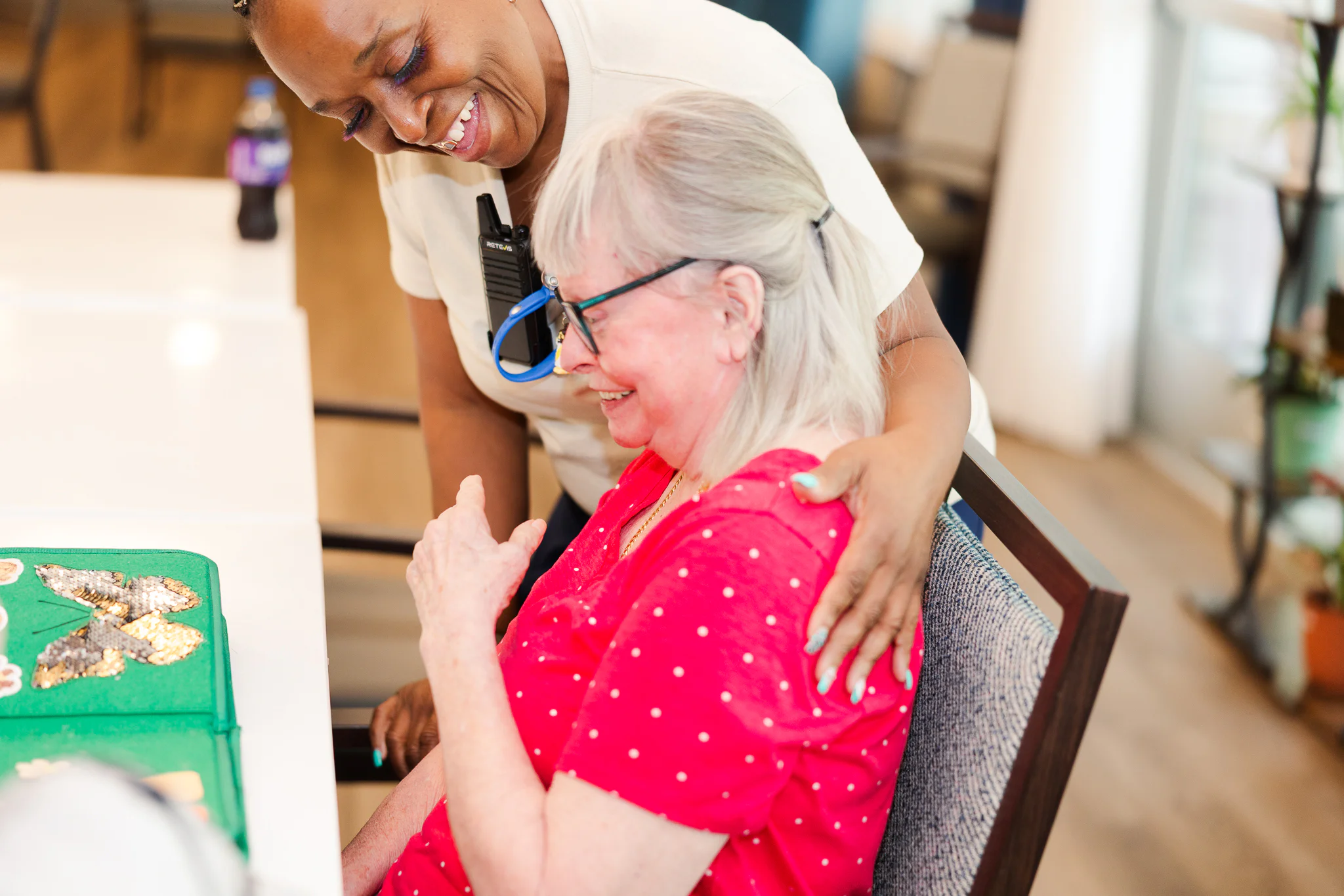 A resident sharing a moment with a caregiver