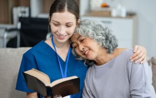 Photo of a senior female with a staff member