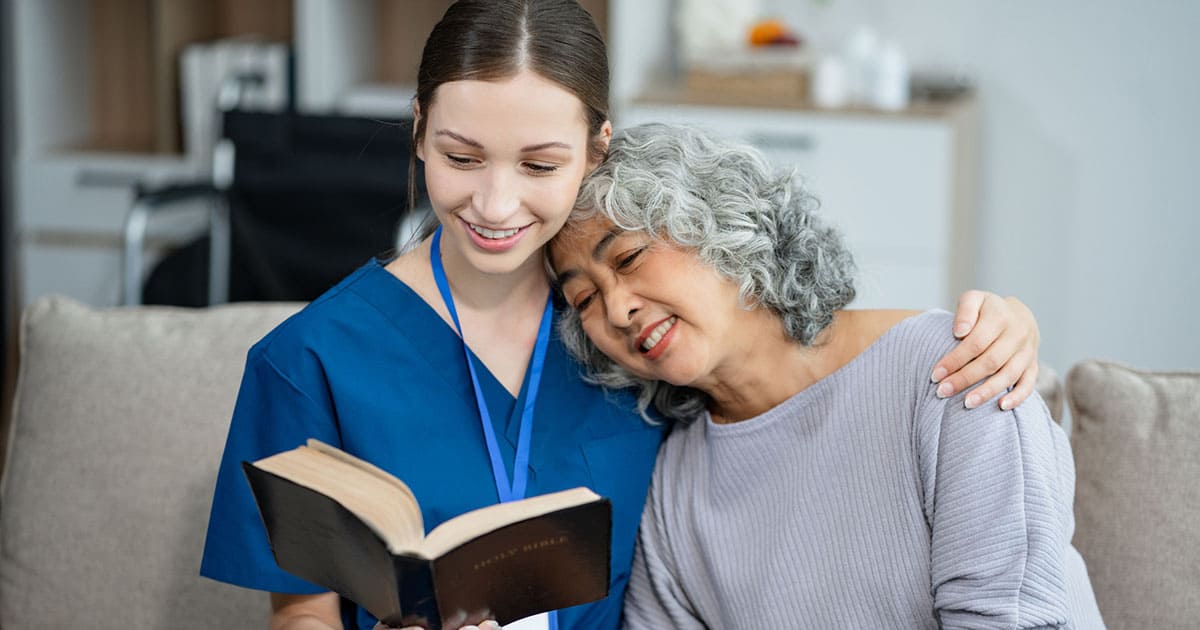 Photo of a senior female with a staff member